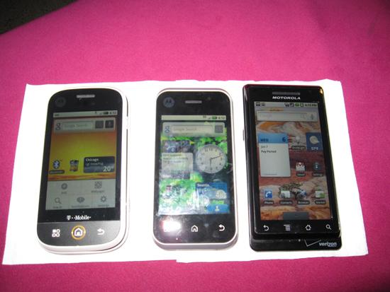 The Motorola Backflip Android phone, next to a Cliq and Droid