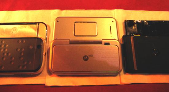 The Motorola Backflip Android phone, next to a Cliq and Droid