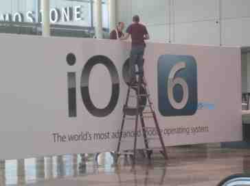 iOS 6 banners being raised at Moscone West, complete with new logo