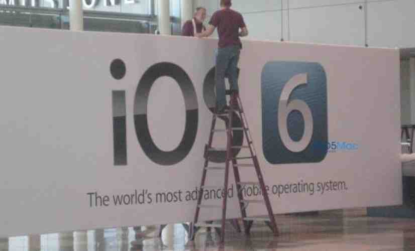 iOS 6 banners being raised at Moscone West, complete with new logo